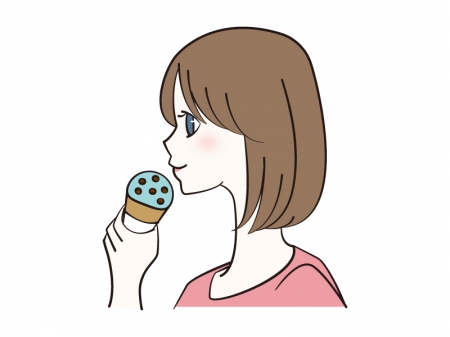 チョコミントアイスを食べる女性のイラスト